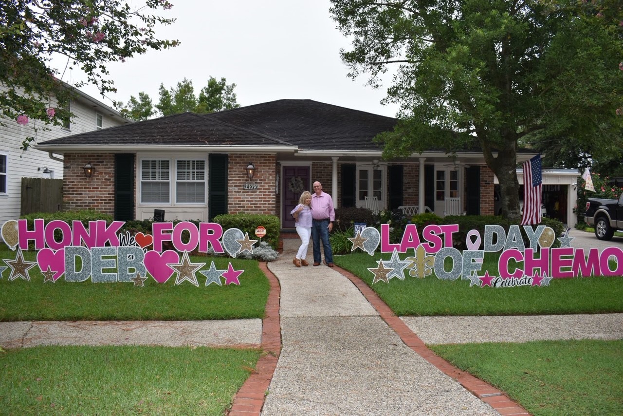 couple on front of the house